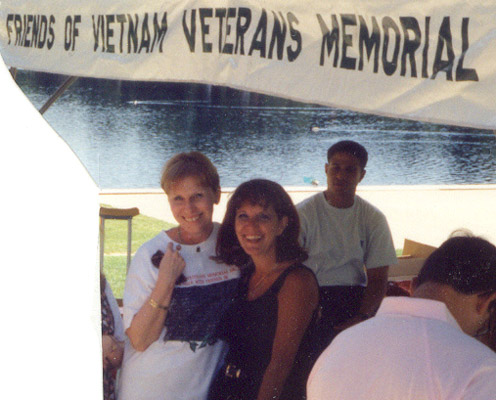 Sharon Denitto and Corky Condon, Director, In Touch program, Vice President, Friends of the Vietnam Veterans Memorial (FVVM), Memorial Day 1994, directory tent on the Washington Mall around the Reflecting Pool